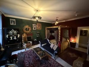 an aerial view of a living room with a bed at The Covenstead in Glastonbury +34 photos