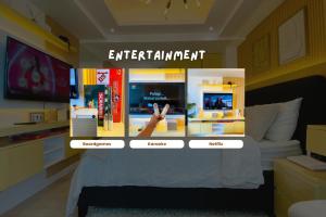 A television and/or entertainment centre at Studio for Couples with Soft Bed and Beach View