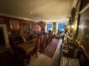 a dining room with a table and chairs at The Covenstead in Glastonbury