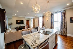 a kitchen and living room with a couch at The Frenchman 2bed - 2 bath in New Orleans