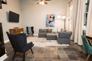 a living room with a couch and two chairs at Monthly - Dumaine Historic Carriage House in New Orleans +15 photos