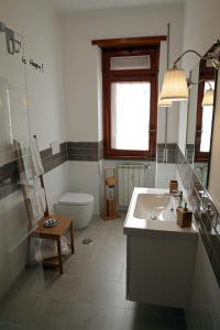 a bathroom with a sink and a toilet at Maison Talenti B&B Roma in Rome