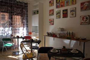 a room with two tables and chairs and a window at Maison Talenti B&B Roma in Rome