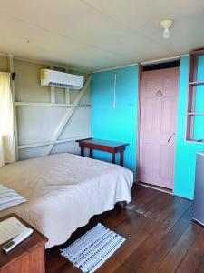 Postel nebo postele na pokoji v ubytování Casa Jade