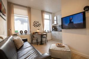 TV a/nebo společenská místnost v ubytování Platz am Meer