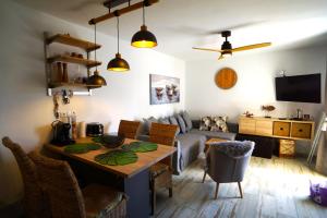 a living room with a table and a couch at Casa del Capitan in Costa Calma