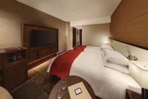 Postel nebo postele na pokoji v ubytování Shiba Park Hotel