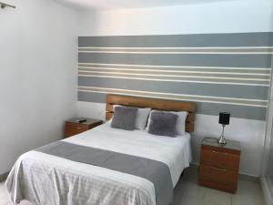 Postel nebo postele na pokoji v ubytování Centro de Santiago