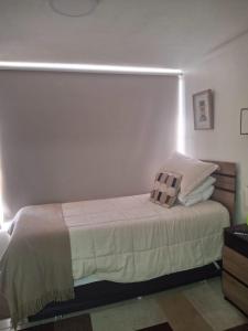 Cama o camas de una habitación en Cómodo departamento