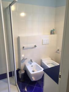 a bathroom with a sink and a toilet at Appartamento il Porto in Baveno +42 photos