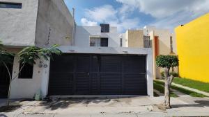 a garage door in front of a building at Casa de Lucas in Balvanera