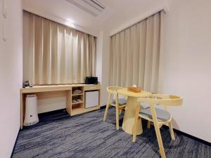 TV a/nebo společenská místnost v ubytování SAKURAKICHI Hotel