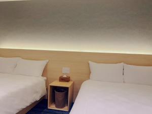 Postel nebo postele na pokoji v ubytování SAKURAKICHI Hotel