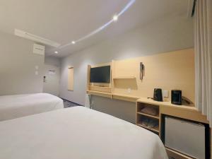 Postel nebo postele na pokoji v ubytování SAKURAKICHI Hotel