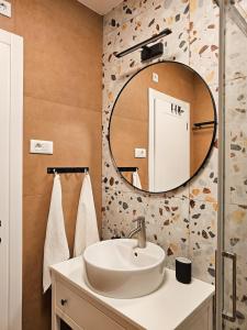 a bathroom with a sink and a mirror at Grandma's house in Rogoznica +40 photos