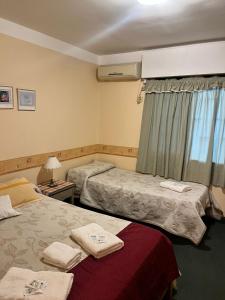 Ένα ή περισσότερα κρεβάτια σε δωμάτιο στο Hotel Terrazas del Sol