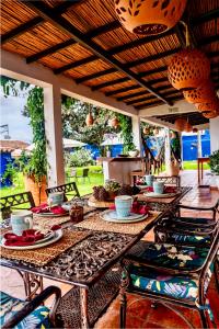a table with plates of food on it on a patio at Apartamento QUIRA 2 in Villa de Leyva
