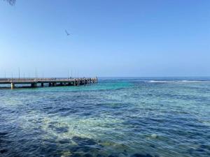 a pier in the middle of the water at Hasy' House-You Jia in Jeddah