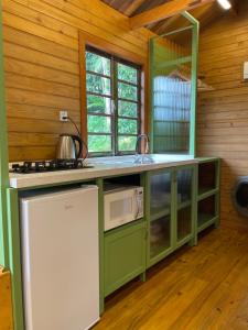 Kuchyň nebo kuchyňský kout v ubytování Chalé alievi + 8 fotografií