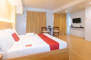 TV a/nebo společenská místnost v ubytování LuxeLite Suites Makati + 21 fotografií