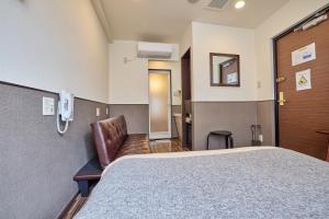 Postel nebo postele na pokoji v ubytování ホテルグランフォート