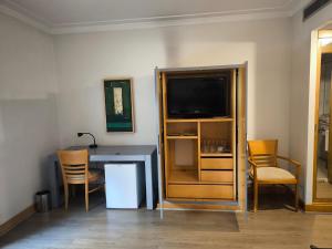TV a/nebo společenská místnost v ubytování Inter Paulista - Flat Hotel