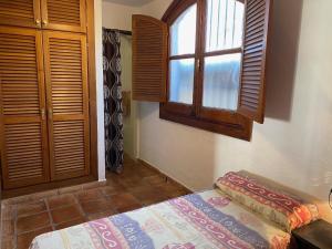Ένα ή περισσότερα κρεβάτια σε δωμάτιο στο CASAS-E-Y -F-pequeño conjunto casas adosado +17 φωτογραφίες