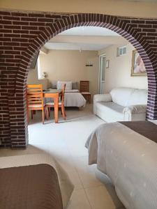 Postel nebo postele na pokoji v ubytování Hotel Real Cortés