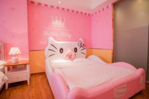 Postel nebo postele na pokoji v ubytování FRAGRANCE House Hanxi Changlong Panyu Wanda Plaza Store