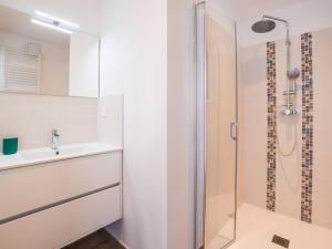 a bathroom with a sink and a shower at Charmante Maison à Quentovic, 3 Chambres - FR-1-821-21 in Le Touquet-Paris-Plage +5 photos