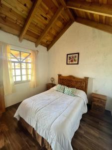 Postel nebo postele na pokoji v ubytování Cabañas el Corral del Rayo Huasca