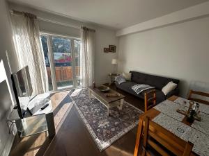 a living room with a couch and a table at Brand New 2 story unit in Richmond Hill