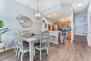 a kitchen and dining room with a table and chairs at 4005 SAN SABASTIAN DRIVE 3BED in Kissimmee