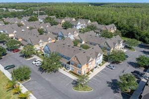an aerial view of a large apartment complex with a parking lot at 4005 SAN SABASTIAN DRIVE 3BED in Kissimmee