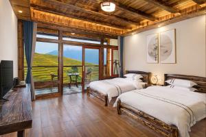 Postel nebo postele na pokoji v ubytování Longji B&B in Cloud + 37 fotografií
