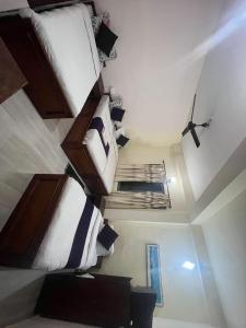 a room with three bunk beds in a room at Hotel Blue lake in Pokhara