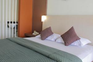 Postel nebo postele na pokoji v ubytování Lux Tychi Hotel