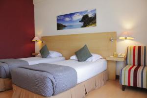 Postel nebo postele na pokoji v ubytování Lux Tychi Hotel