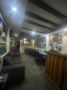 a dining room with a table and some chairs at Hotel Blue lake in Pokhara