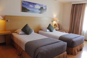 Postel nebo postele na pokoji v ubytování Lux Tychi Hotel