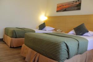 Postel nebo postele na pokoji v ubytování Lux Tychi Hotel