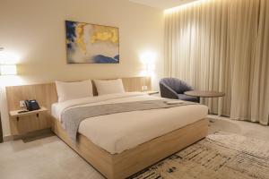 Postel nebo postele na pokoji v ubytování ISHQ Hotel