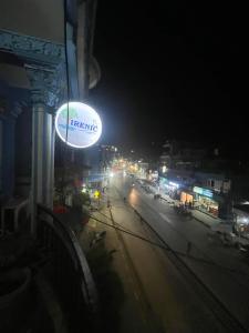 a lit up sign on a street at night at Hotel Blue lake in Pokhara