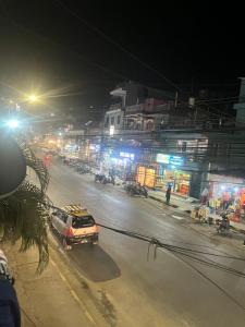a car driving down a city street at night at Hotel Blue lake in Pokhara
