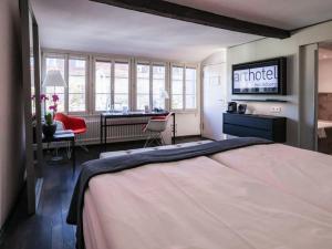 Postel nebo postele na pokoji v ubytování Arthotel Heidelberg