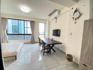 Μια τηλεόραση ή/και κέντρο ψυχαγωγίας στο 欣欣背包商旅青旅酒店3館