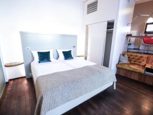 Postel nebo postele na pokoji v ubytování Arthotel Heidelberg