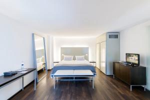 Postel nebo postele na pokoji v ubytování Arthotel Heidelberg