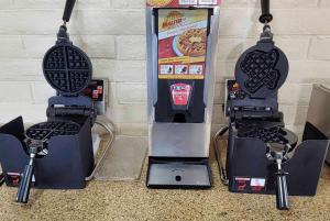 a ticket vending machine next to a pizza machine at La Quinta Inn by Wyndham Amarillo West Medical Center in Amarillo +58 photos