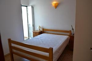 Llit o llits en una habitació de Lagos Rustic House